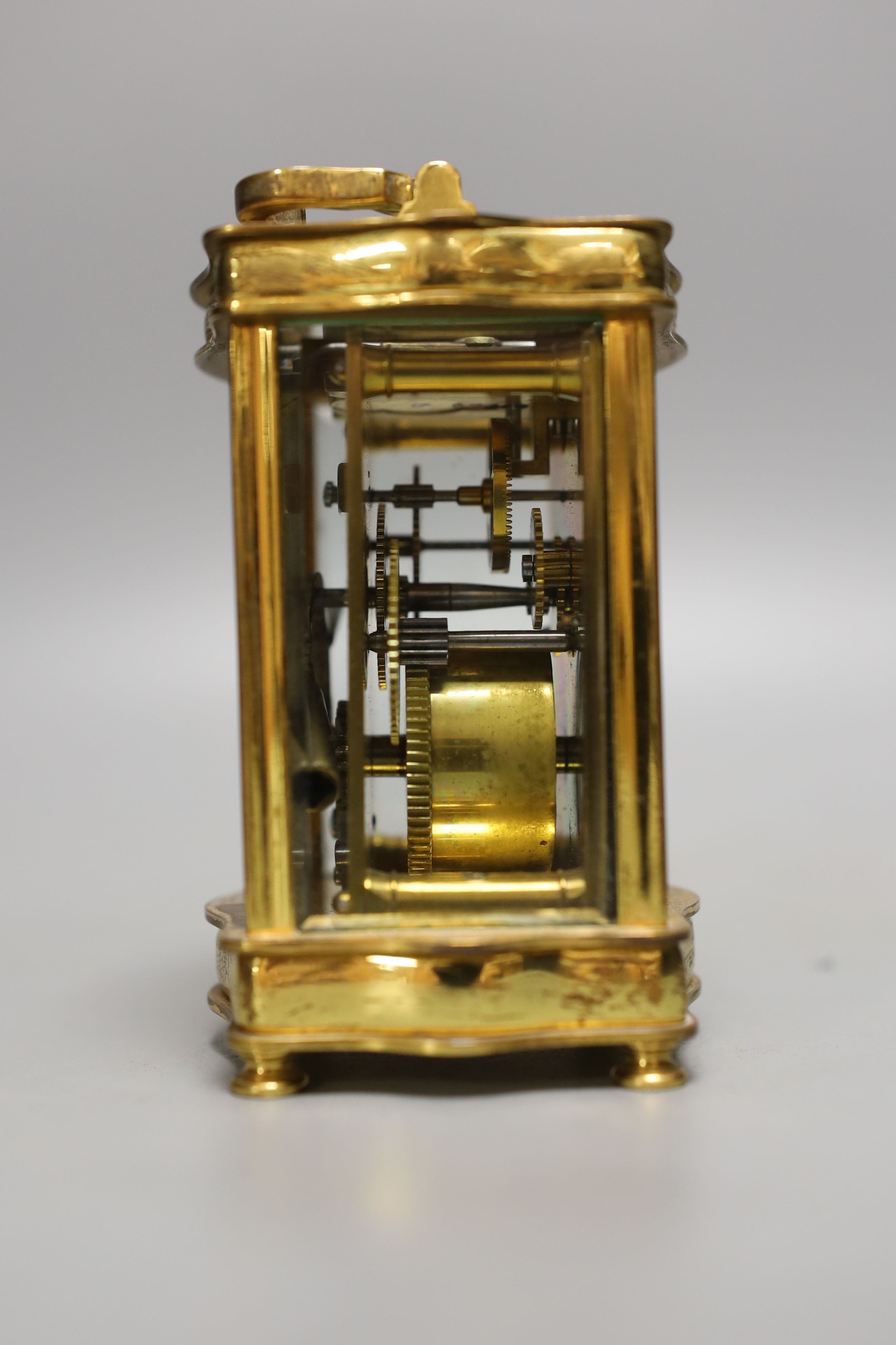 A French brass cased carriage timepiece with case. 11cm